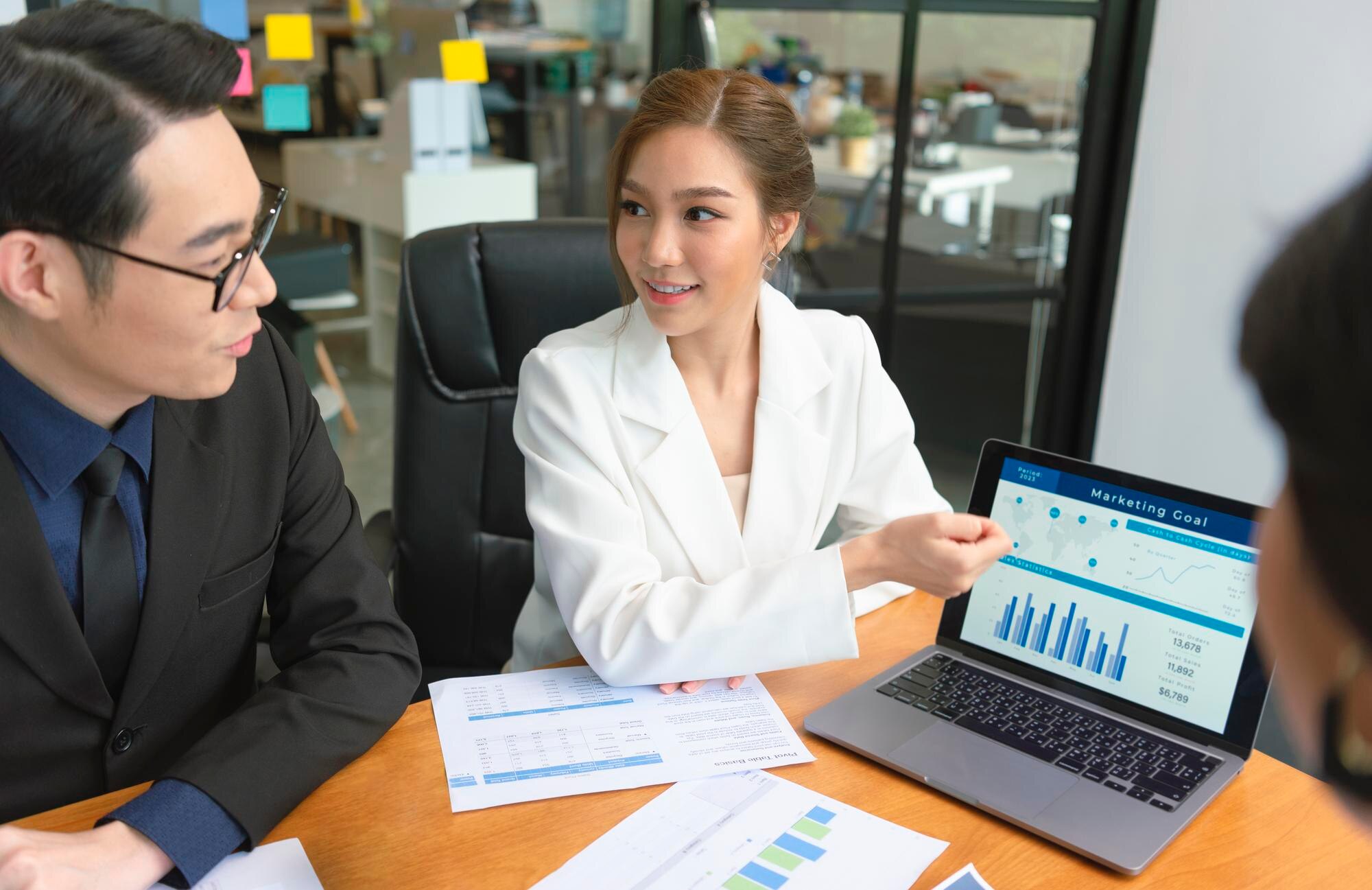 business-people-meeting-about-business-plan-present-explain-stock-financial-chart_74952-2605