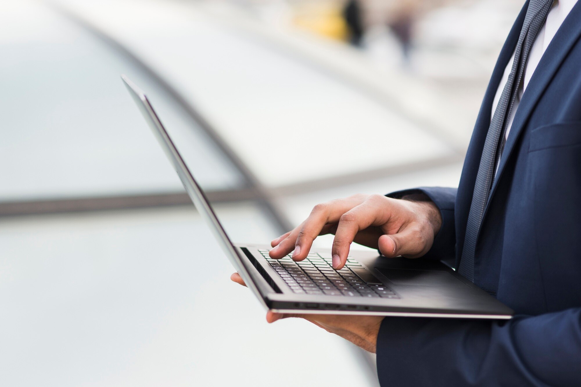 close-up-man-working-laptop_23-2148479537